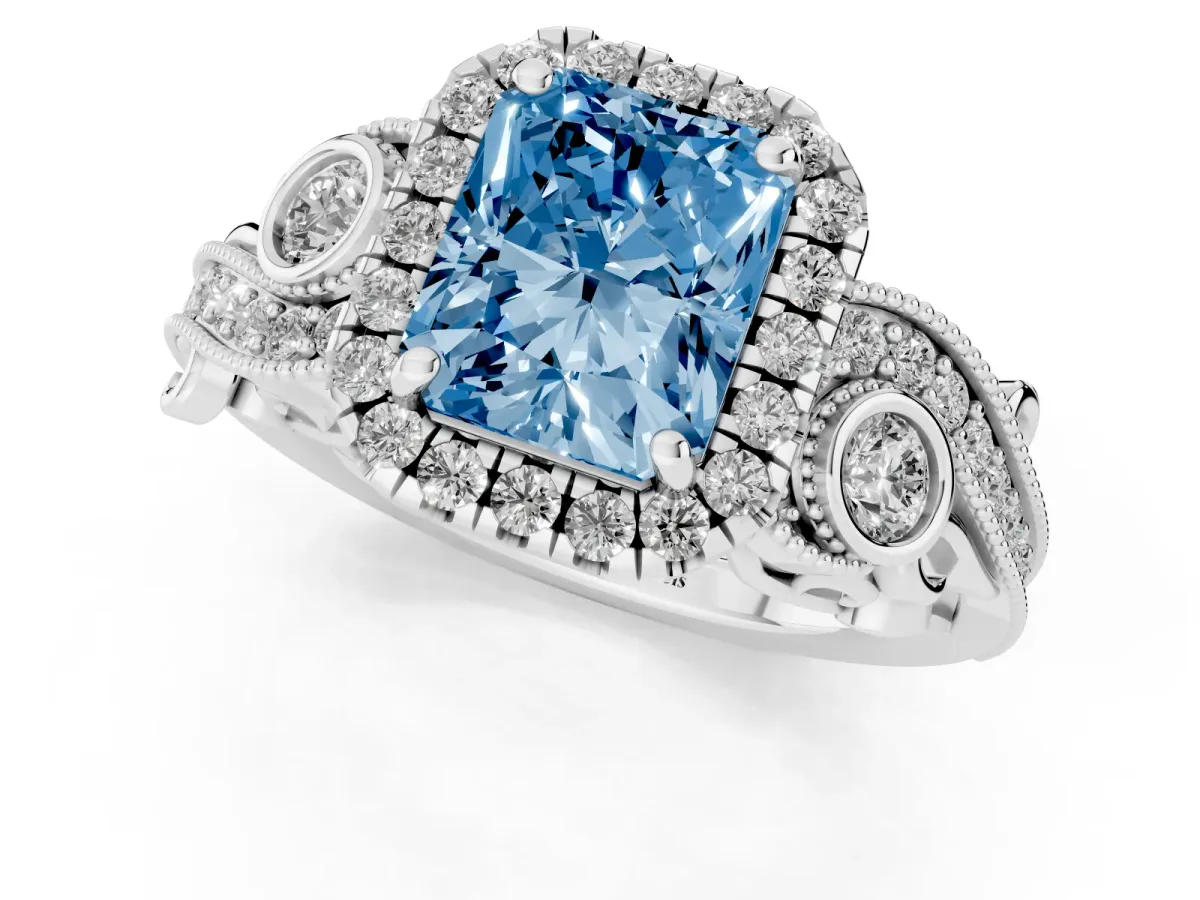 Fancy Blue Radiant Cut Halo Diamond Ring with Milgrain and Bezel Accents on a Split Shank Band Platinum
