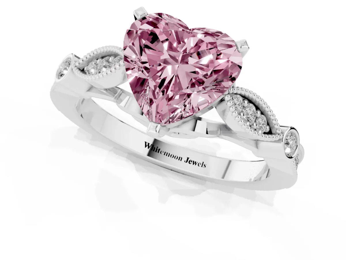 Fancy Pink Heart Cut Cut Diamond with Milgrain Marquise and Bezel Accents on a Solitaire Band with Prong Setting Platinum