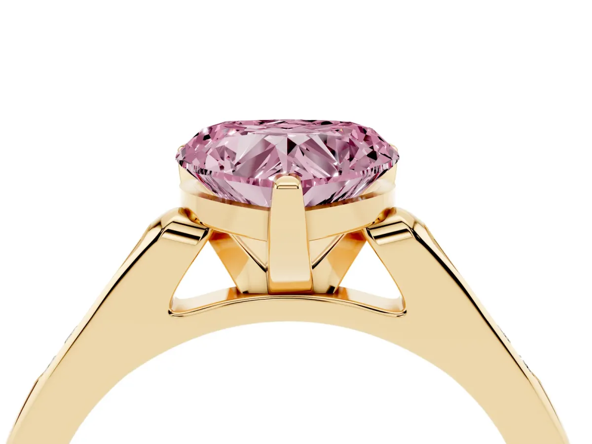 Fancy Pink Heart Cut Diamond Solitaire Ring with Channel Set Round Band and Prong Setting Yellow gold