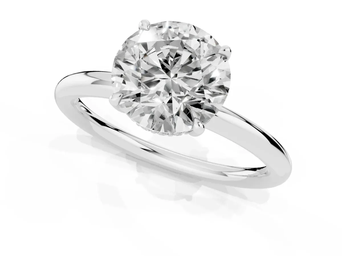 Round Cut Diamond Solitaire Ring with Thin Band and Four-Prong Setting Silver