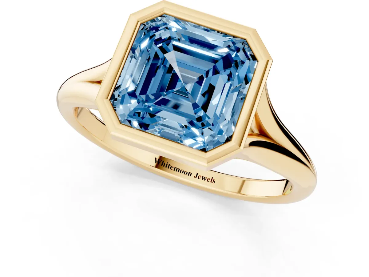 Fancy Blue Bezel Set Asscher Cut Cut Solitaire Ring with Tapered Band Yellow gold