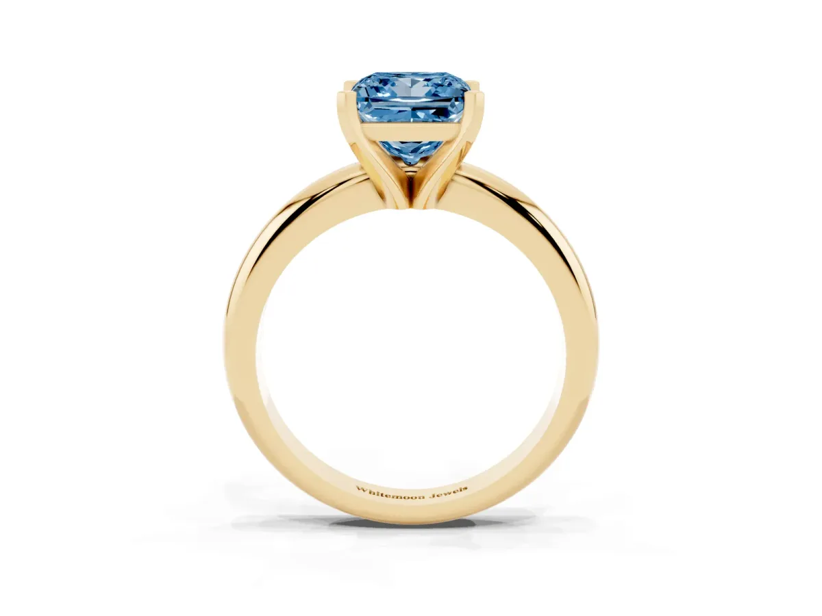Fancy Blue Princess Cut Diamond Solitaire Engagement Ring with Round Band and Four-Prong Setting Yellow gold