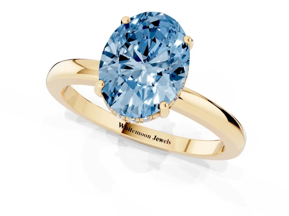 Fancy Blue Oval Cut Solitaire Diamond Ring with Prong Setting and Plain Band Yellow gold