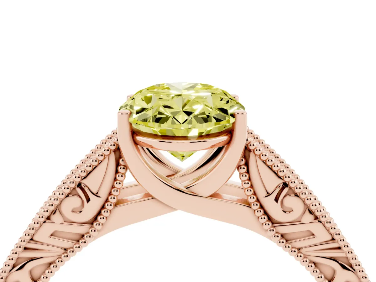 Fancy Yellow Oval Cut Diamond Solitaire Ring with Engraved Band and Four-Prong Setting Rose gold