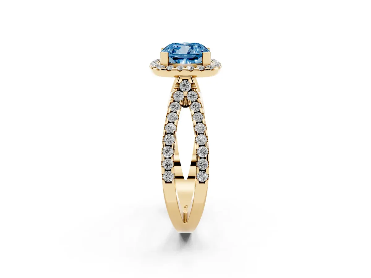 Fancy Blue Cushion Cut Diamond Halo Ring with Split Shank Pavé Band and Prong Setting Yellow gold