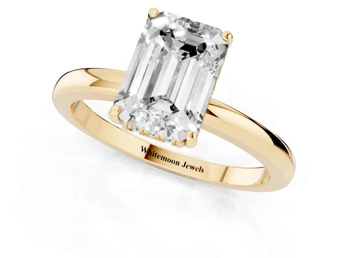 Emerald Cut Solitaire Diamond Ring with Prong Setting and Plain Band Yellow gold