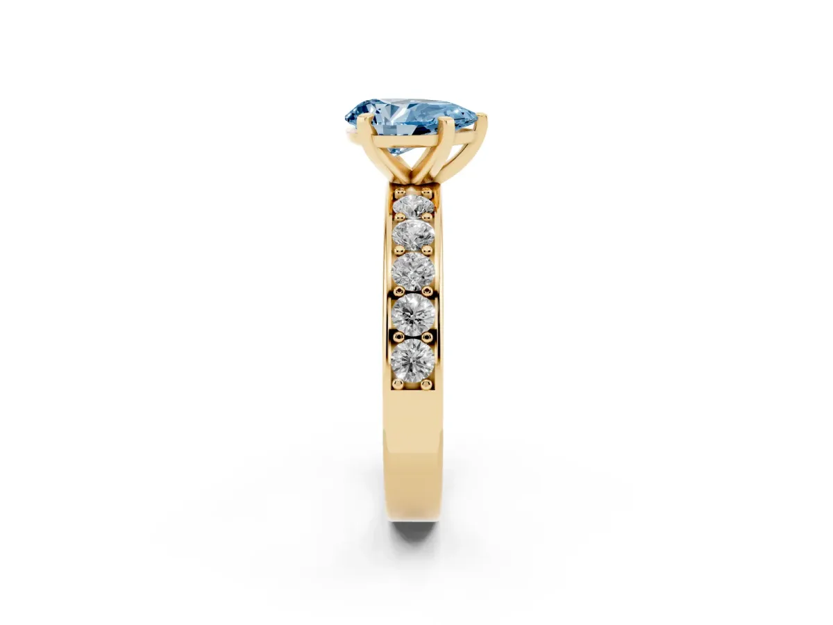 Fancy Blue Pear Cut Diamond Engagement Ring with Channel Set Round Band and Prong Setting Yellow gold