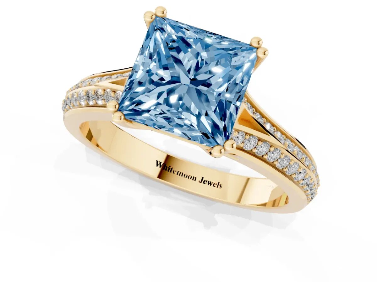 Fancy Blue Princess Cut Diamond Split Shank Engagement Ring with Pavé Band Yellow gold