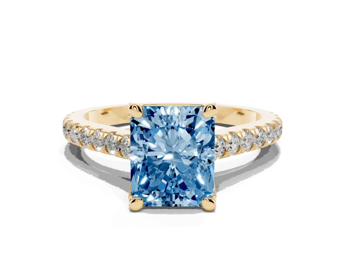 Fancy Blue Radiant Cut Brilliant Diamond Solitaire with Pavé Band and Four-Prong Setting Yellow gold