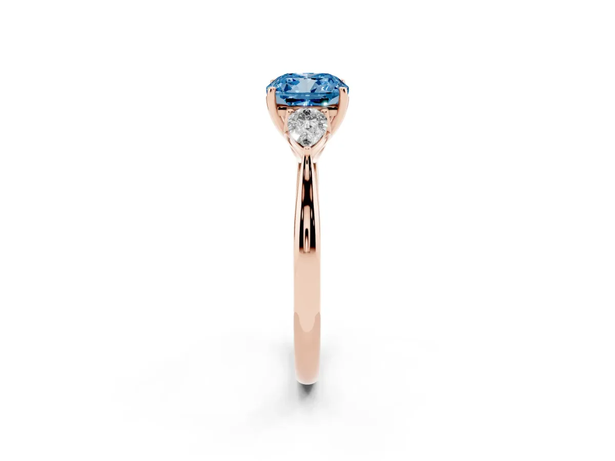 Fancy Blue Three-Stone Cushion Cut Brilliant Diamond Solitaire Ring with Tapered Band and Four-Prong Setting Rose gold
