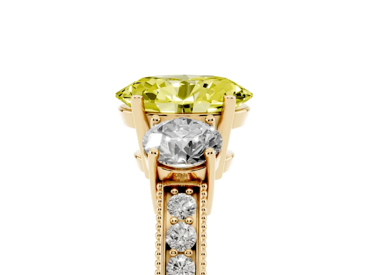 Fancy Yellow Oval Cut Three-Stone Diamond Ring with Pavé Band and Four-Prong Setting Yellow gold