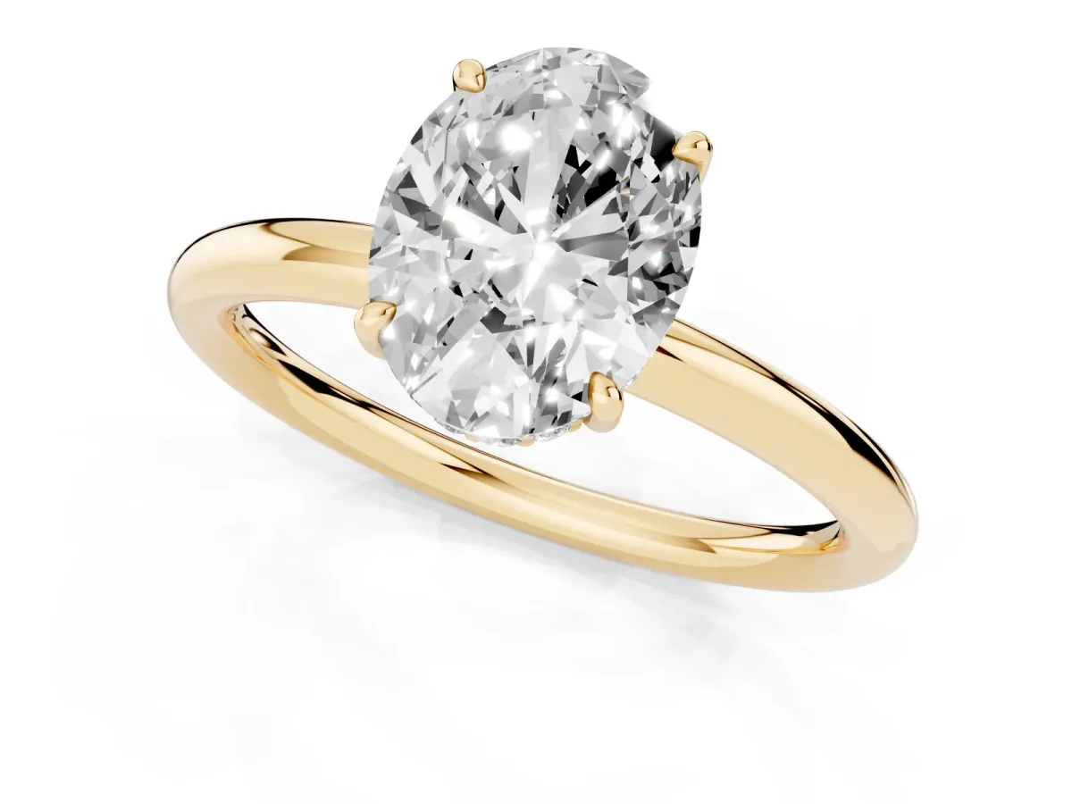Oval Cut Diamond Solitaire Ring with Thin Band and Four-Prong Setting Yellow gold