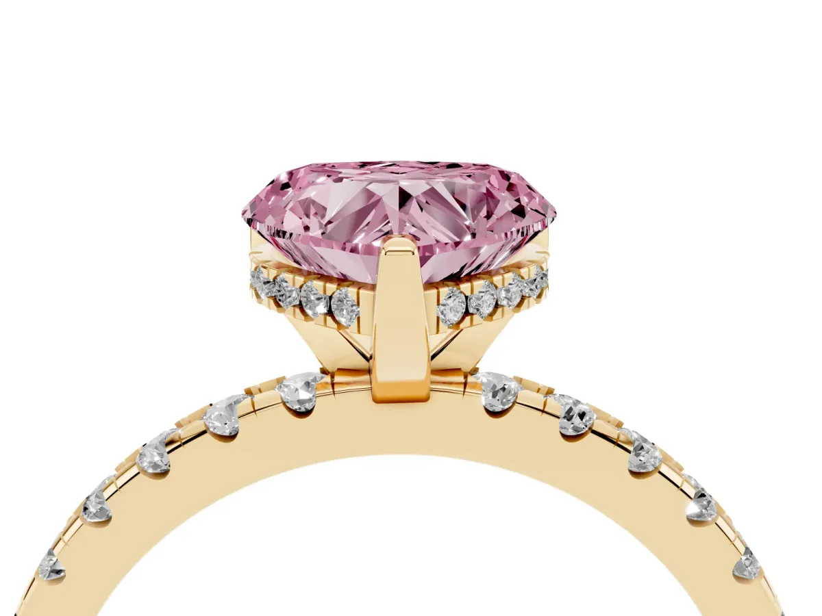 Fancy Pink Heart Cut Diamond Solitaire Ring with Round Pavé Band and Four-Prong Setting Yellow gold