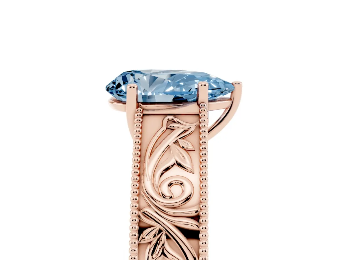 Fancy Blue Pear Cut Diamond Solitaire Ring with Engraved Band and Four-Prong Setting Rose gold