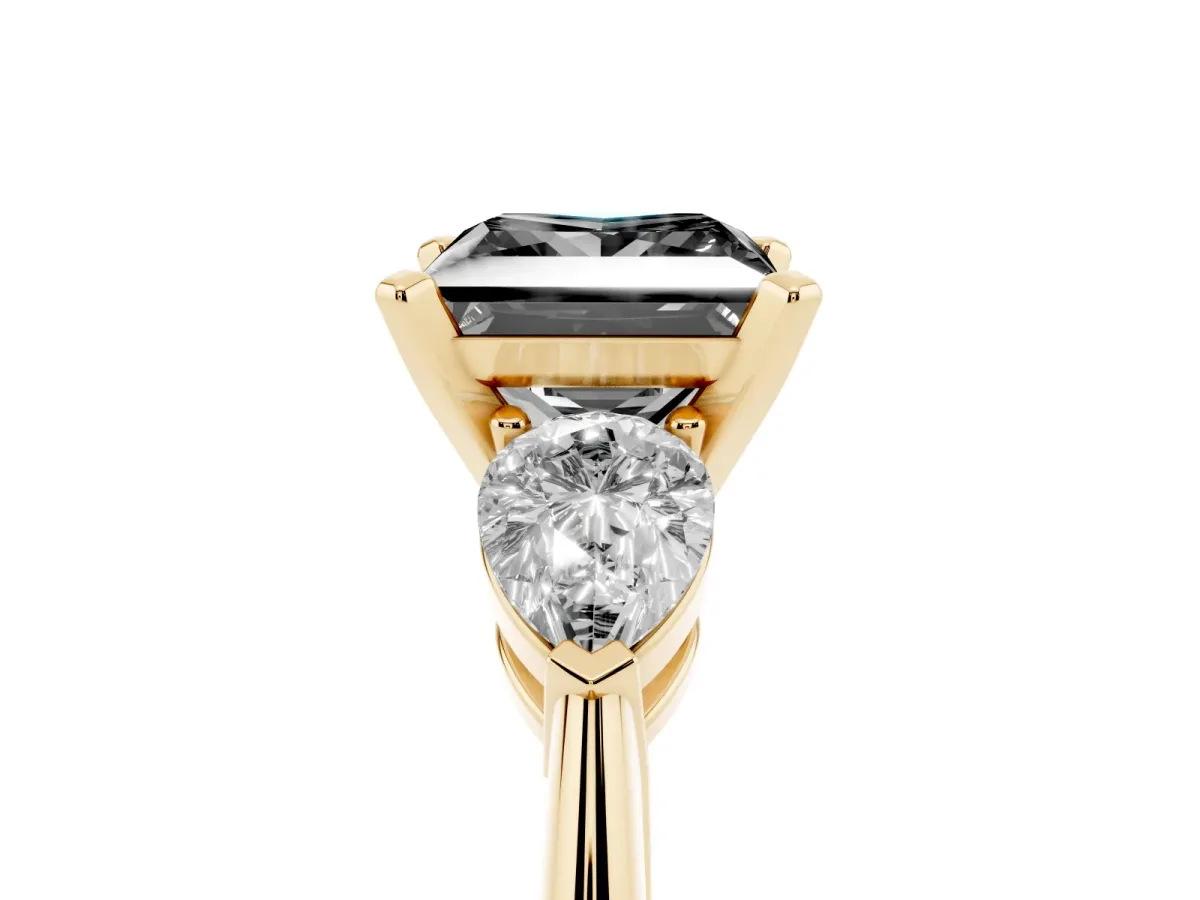 Fancy Black Three-Stone Princess Cut Diamond Ring with Pear Side Stones and Four-Prong Setting Yellow gold