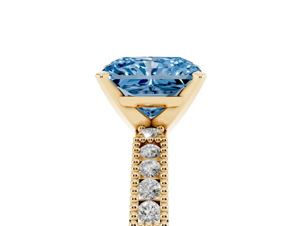 Fancy Blue Radiant Cut Solitaire with Pavé Band and Four-Prong Setting Yellow gold