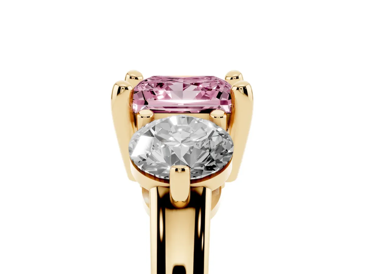 Fancy Pink Three-Stone Princess Cut Brilliant Cut Solitaire Ring with Prong Setting on a Classic Band Yellow gold