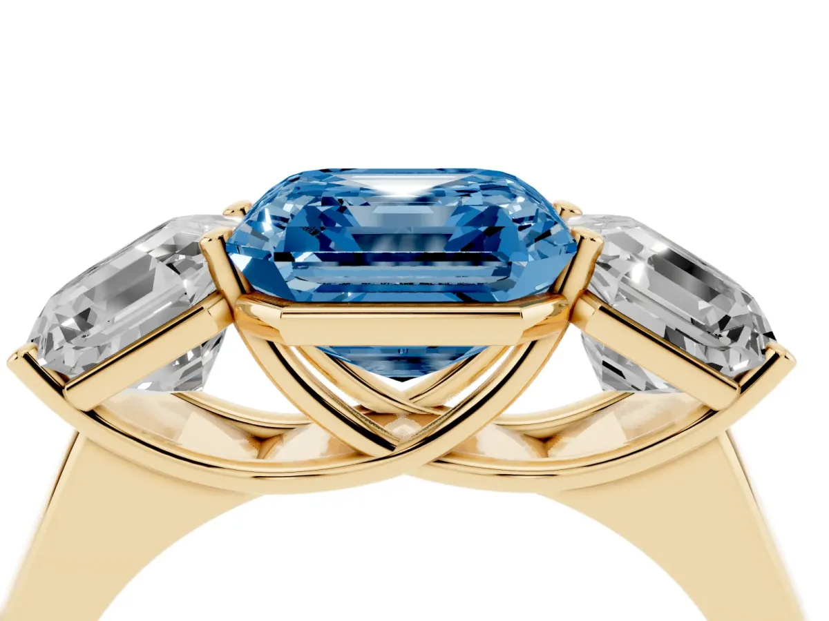 Fancy Blue Asscher Cut Three-Stone Diamond Ring with Prong Setting on a Classic Band Yellow gold
