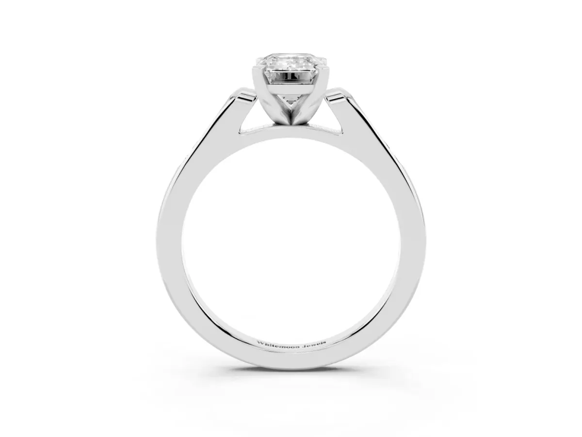 Emerald Cut Diamond Solitaire Ring with Channel Set Round Band and Prong Setting White gold