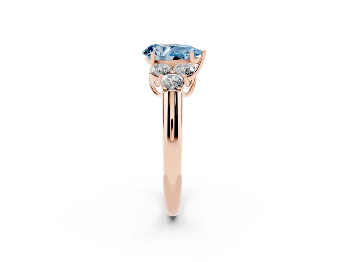 Fancy Blue Pear Cut Cut Diamond Cluster Ring with Round Accent Stones and Prong Setting on a Classic Band Rose gold