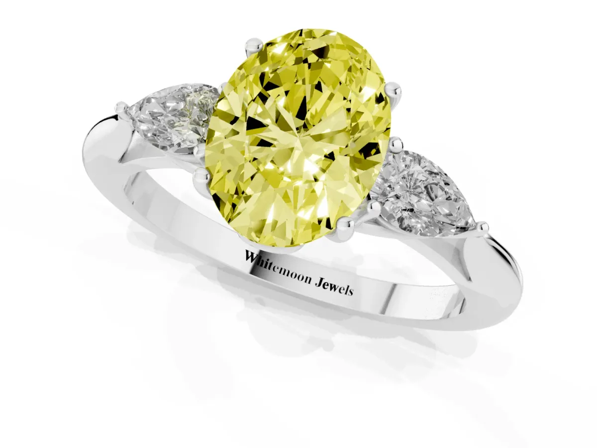 Fancy Yellow Three-Stone Oval Cut Brilliant Diamond Solitaire Ring with Tapered Band and Four-Prong Setting Silver