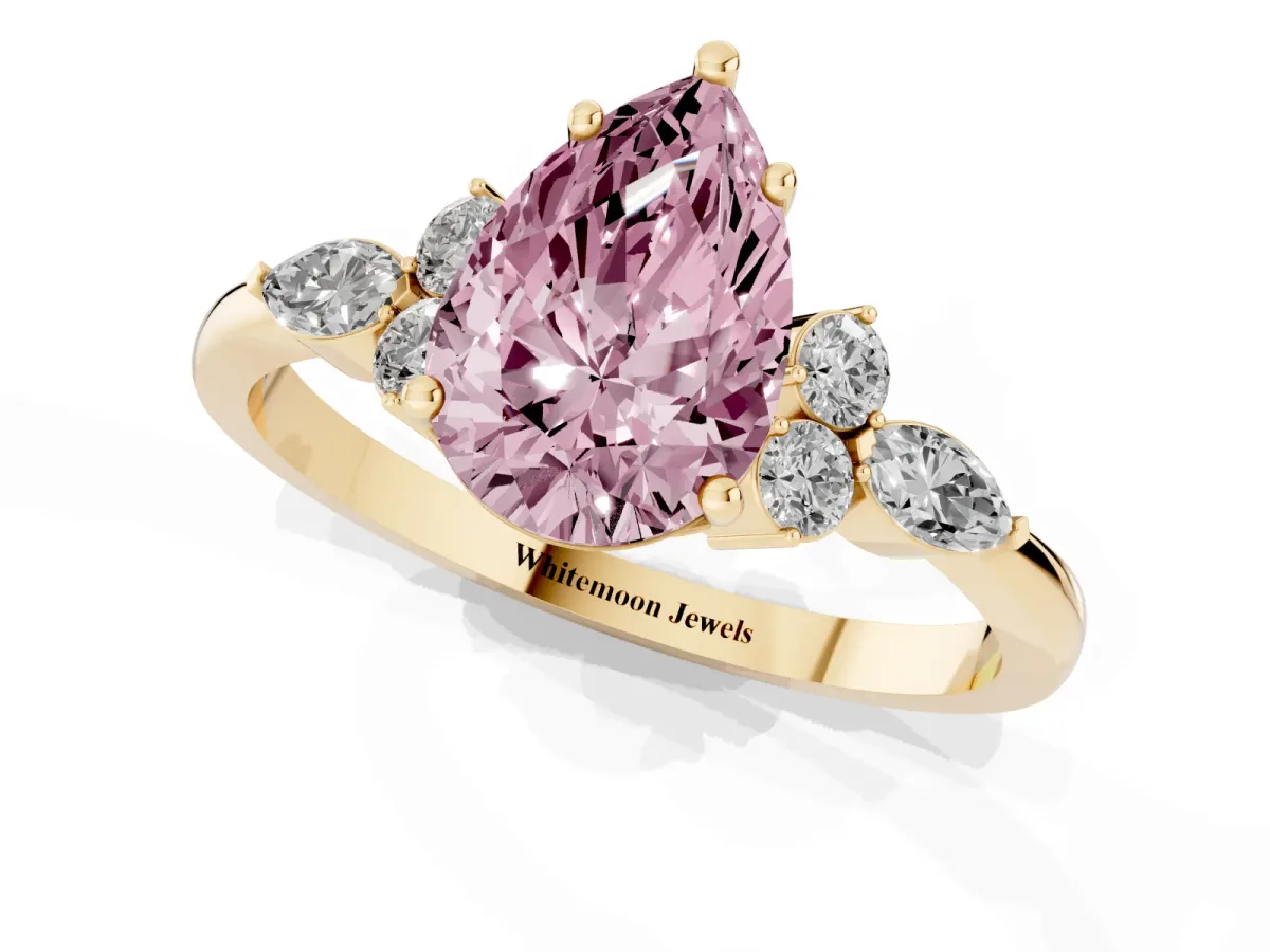 Fancy Pink Pear Cut Brilliant Diamond Solitaire Ring with Pear Side Stones and Four-Prong Setting Yellow gold