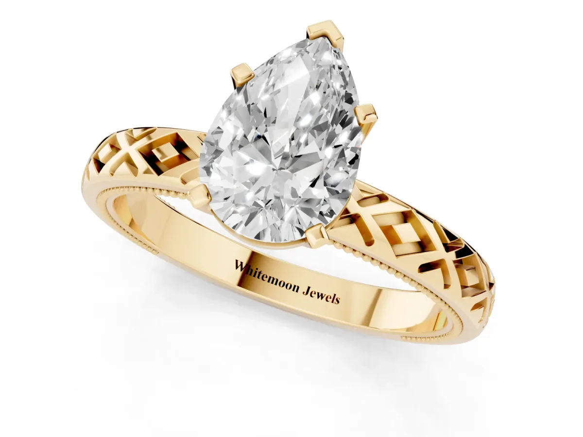 Pear Cut Solitaire Diamond Ring with Milgrain and Black Enamel X Pattern Band Yellow gold