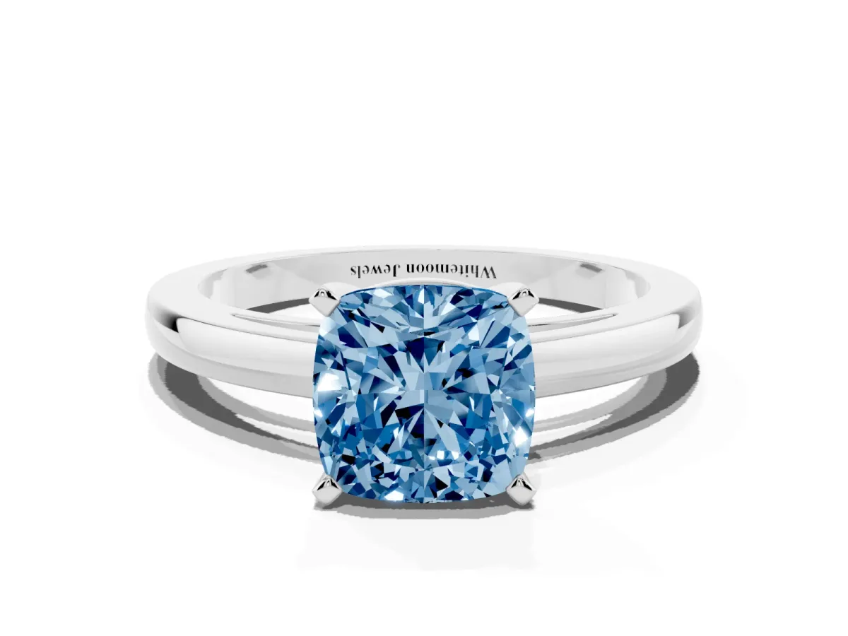 Fancy Blue Cushion Cut Solitaire Diamond Engagement Ring with Four-Prong Setting on a Classic Band Platinum