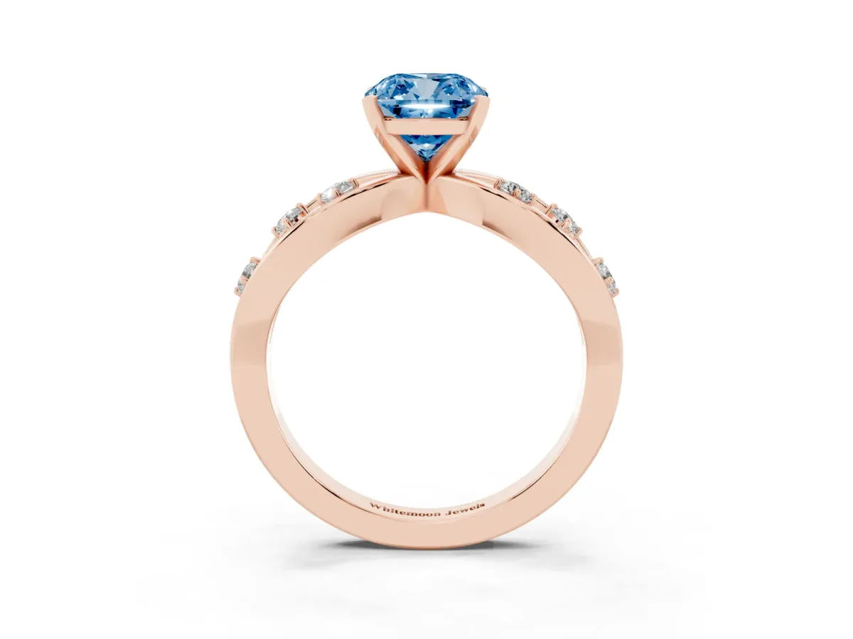 Fancy Blue Cushion Cut Cut Solitaire Diamond with Side Stones on Criss-Cross Band and Four-Prong Setting Rose gold