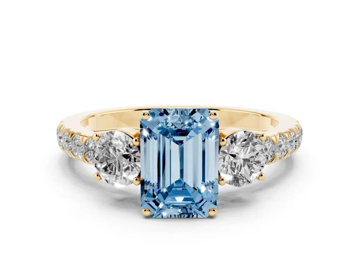 Fancy Blue Emerald Cut Cut Diamond Three-Stone Ring with Round Side Stones and Pavé Band Yellow gold