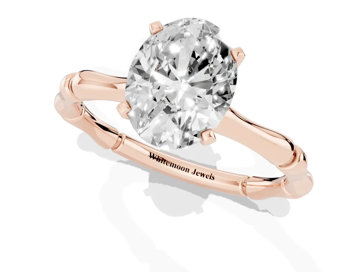 Oval Cut Solitaire Diamond Ring with Bamboo Band and Four-Prong Setting Rose gold