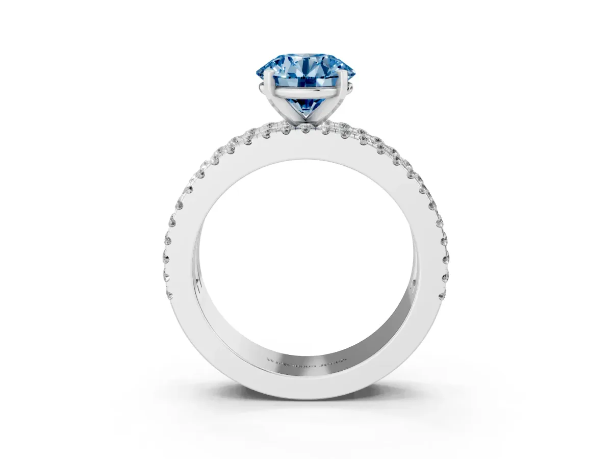 Fancy Blue Round Cut Diamond Solitaire Ring with Pavé and Channel Set Band Platinum