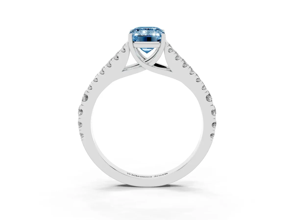 Fancy Blue Emerald Cut Diamond Split Shank Pavé Engagement Ring with Four-Prong Setting Silver