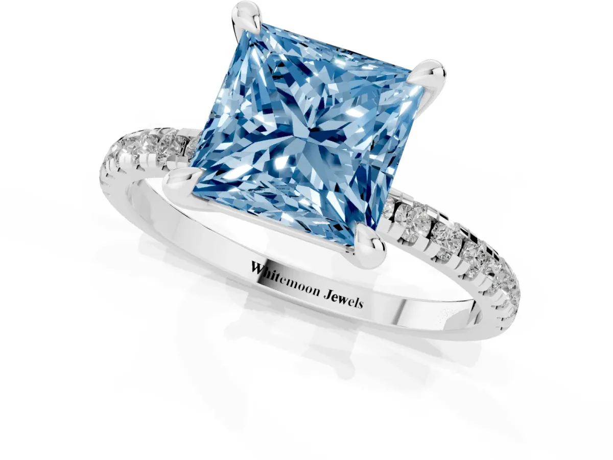 Fancy Blue Princess Cut Diamond Brilliant Solitaire Ring with Pavé Band and Four-Prong Setting Silver