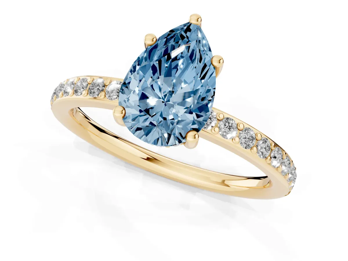 Fancy Blue Pear Cut Cut Diamond Pavé Band Ring with Four-Prong Setting Yellow gold