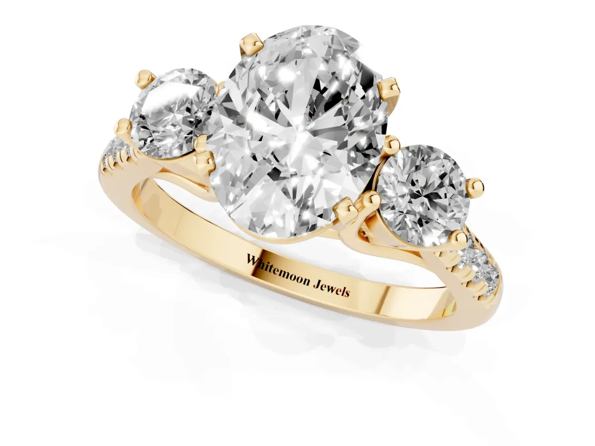 Three-Stone Oval Cut Diamond Pavé Band with Four-Prong Setting Yellow gold
