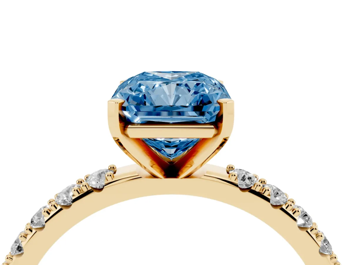 Fancy Blue Radiant Cut Diamond Solitaire Pavé Band with Four-Prong Setting Yellow gold