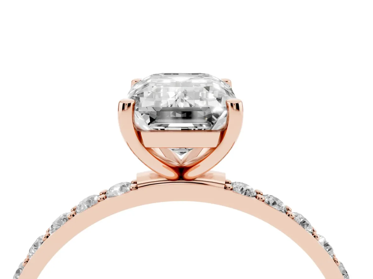 Emerald Cut Diamond Solitaire Ring with Round Pavé Shoulders and Prong Setting Rose gold