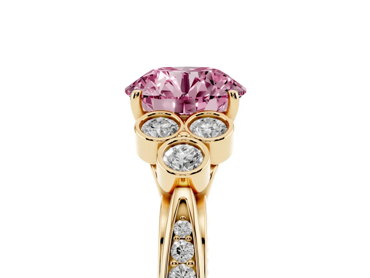 Fancy Pink Round Cut Cut Diamond Engagement Ring with Bezel Set Round Side Stones and Prong Setting Yellow gold