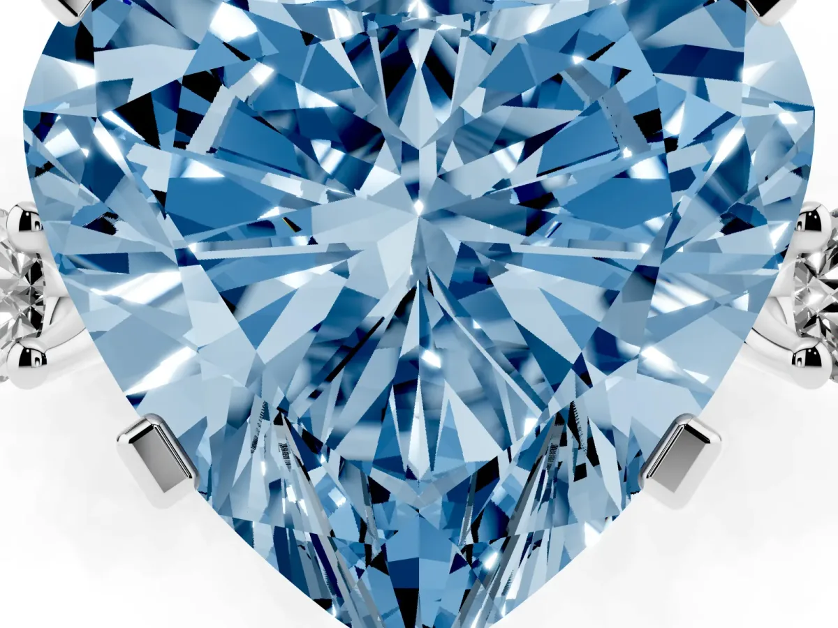 Fancy Blue Heart Cut Cut Three-Stone Solitaire Ring with Round Accent Diamonds and Four-Prong Setting Silver
