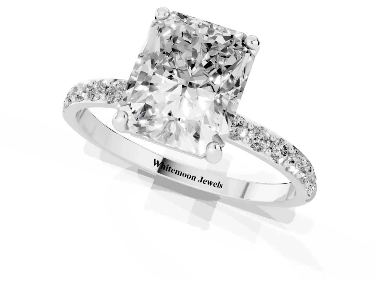 Radiant Cut Diamond Solitaire Ring with Round Pavé Band and Prong Setting Silver