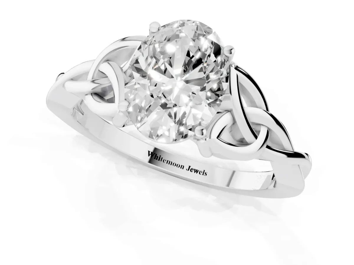 Oval Cut Diamond Solitaire Engagement Ring with Celtic Knot Band and Four-Prong Setting White gold