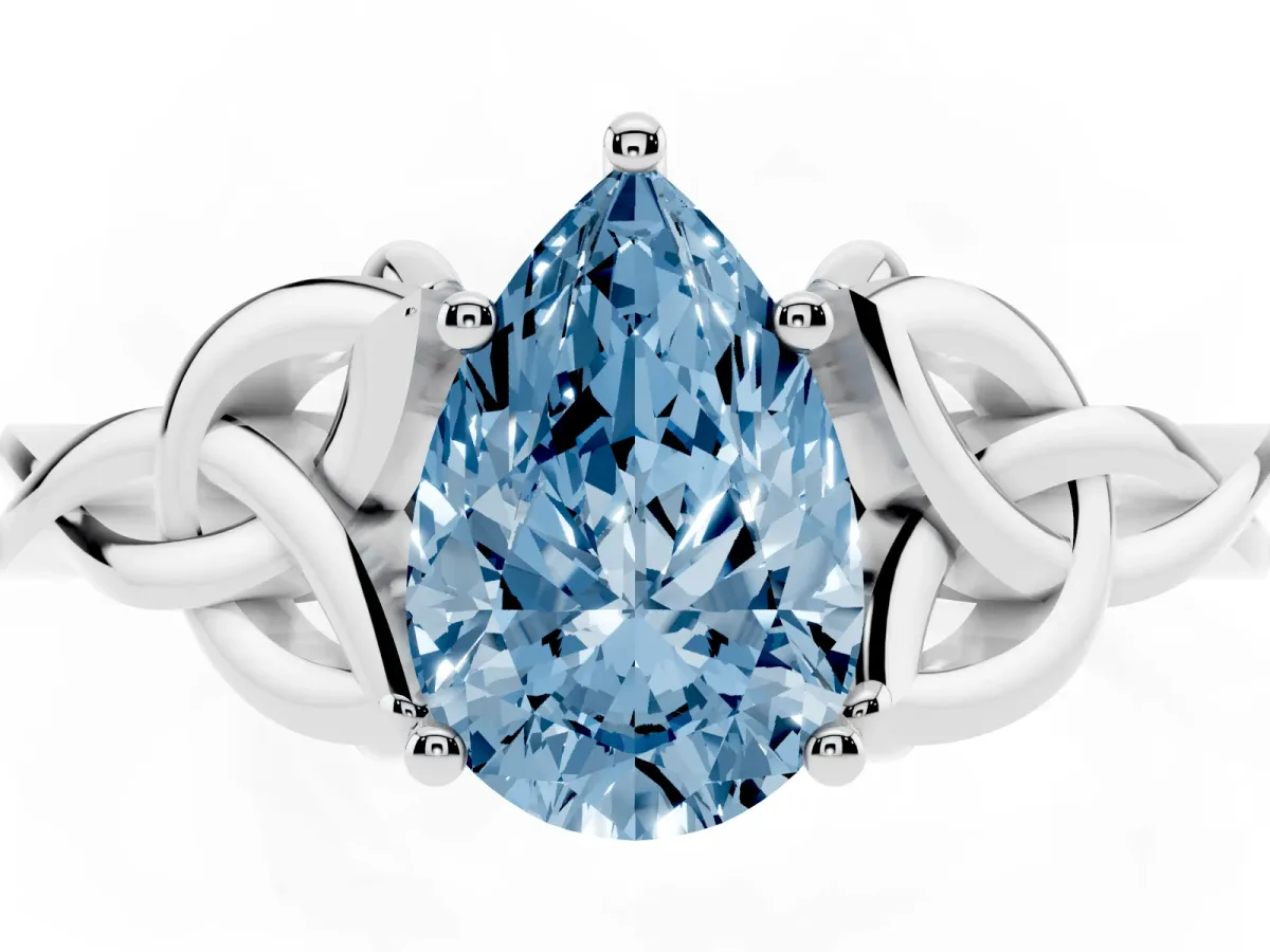 Fancy Blue Pear Cut Diamond Solitaire Engagement Ring with Celtic Knot Band and Four-Prong Setting Silver