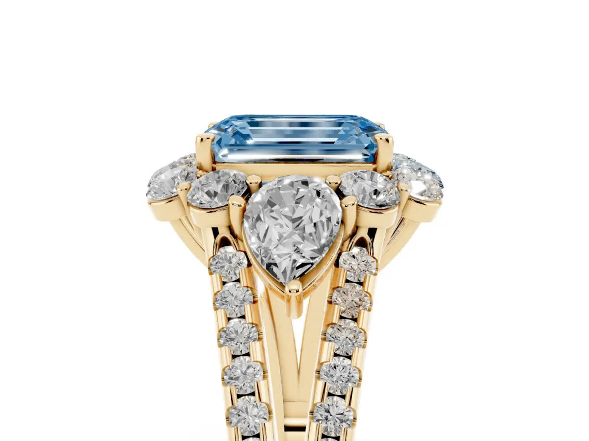 Fancy Blue Emerald Cut Halo Split Shank Diamond Engagement Ring with Prong Setting Yellow gold