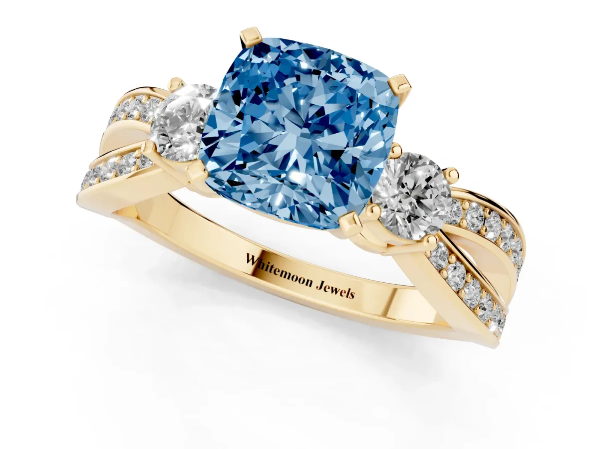 Fancy Blue Three-Stone Cushion Cut Cut Diamond Twist Band with Prong Setting Yellow gold