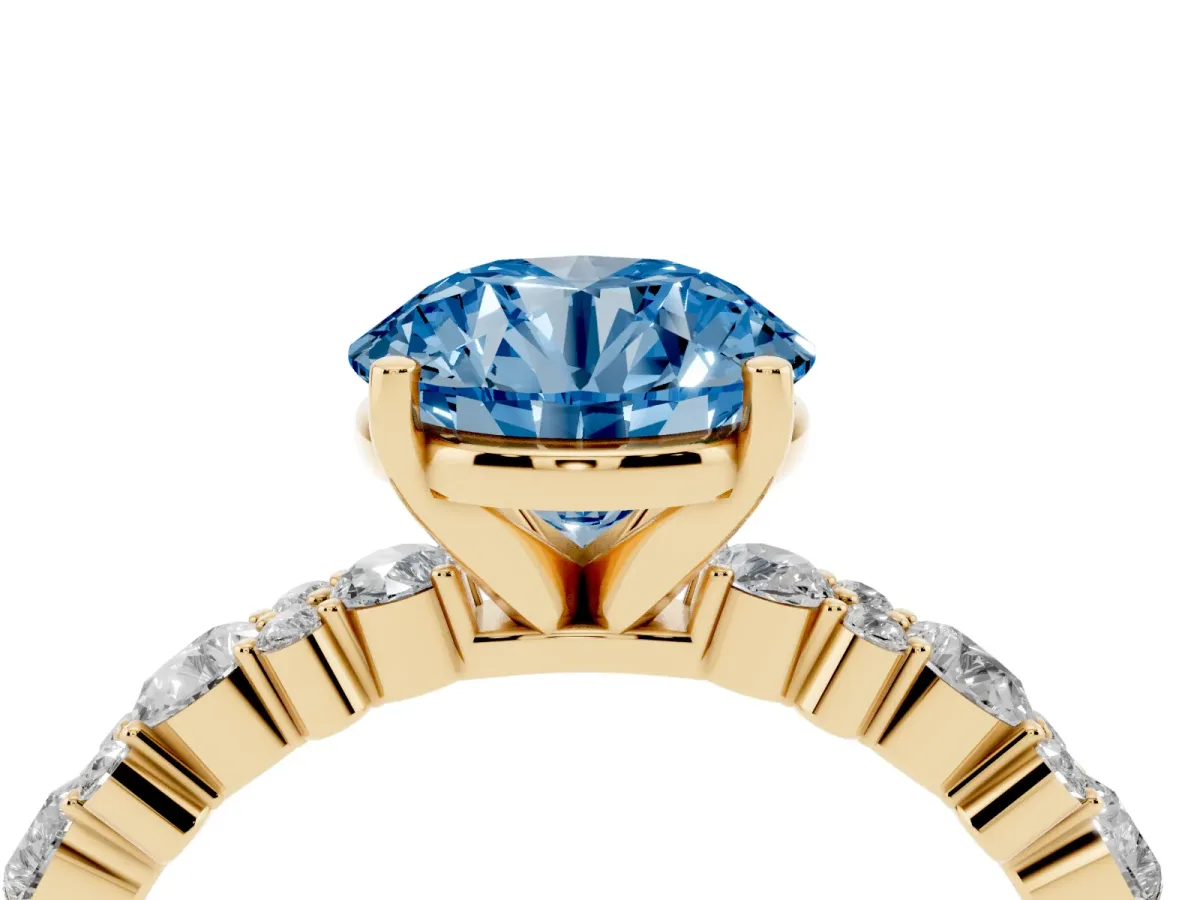 Fancy Blue Round Cut Diamond Side Stone Solitaire Ring with Round and Four-Prong Setting Yellow gold