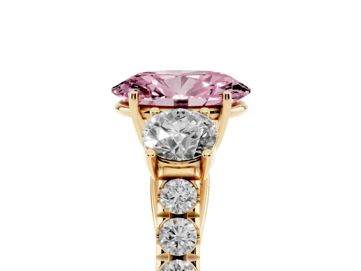 Fancy Pink Oval Cut Cut Diamond Three-Stone Ring with Round Side Stones and Pavé Band Yellow gold