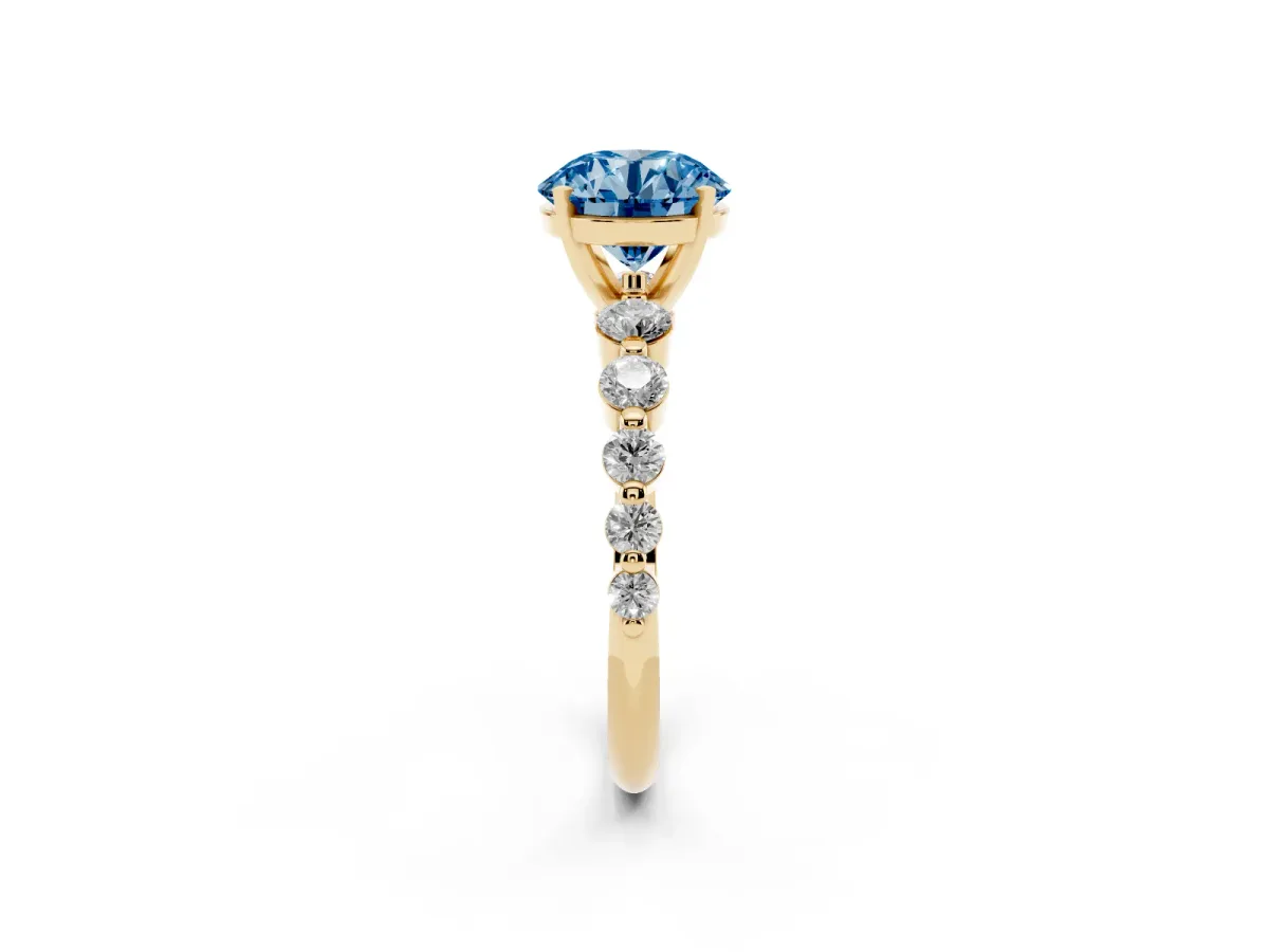 Fancy Blue Round Cut Solitaire Diamond Ring with Pave Band and Four-Prong Setting Yellow gold