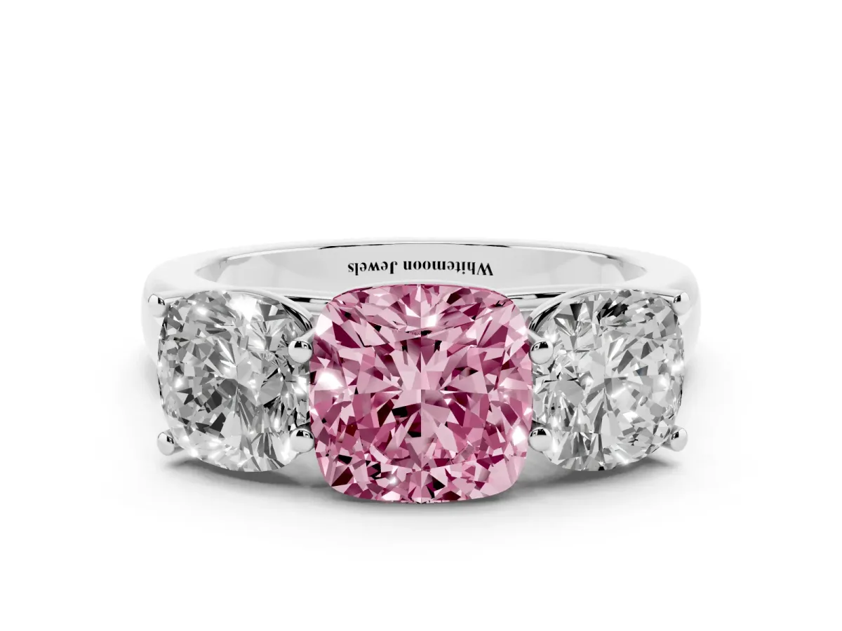 Fancy Pink Cushion Cut Three-Stone Diamond Ring with Prong Setting on a Classic Band Platinum