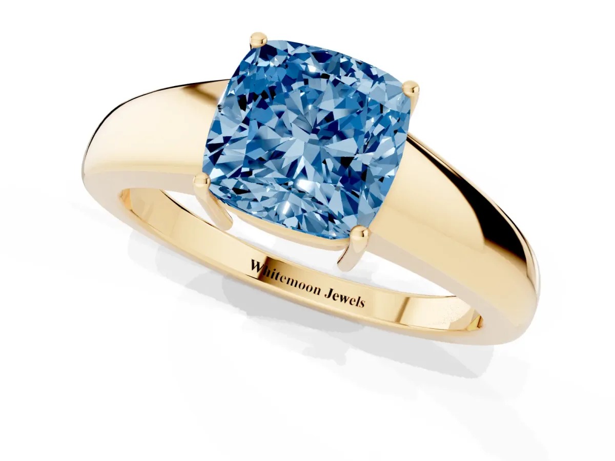 Fancy Blue Cushion Cut Solitaire Diamond Ring with Tapered Band and Four-Prong Setting Yellow gold